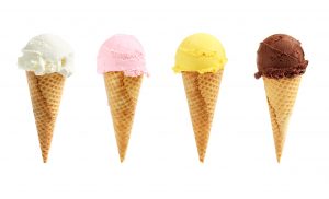 Assorted ice cream flavors in waffle cones