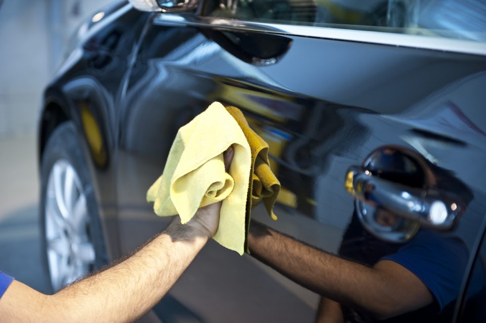 Man cleaning car