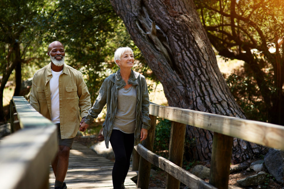 Shot of a happy senior couple out for a hike on a sunny day