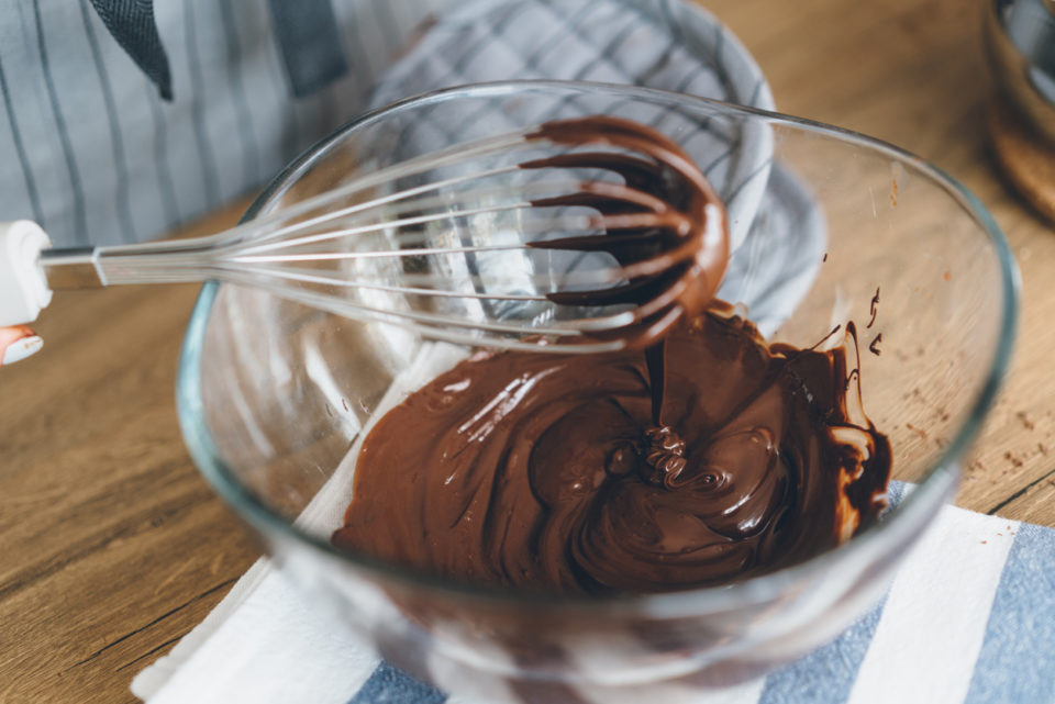 Young woman mixing the chocolate bowl