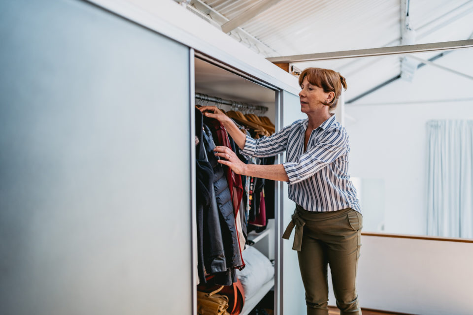 Woman cleaning out closet