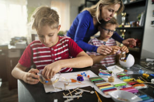 Mother and sons making crafts