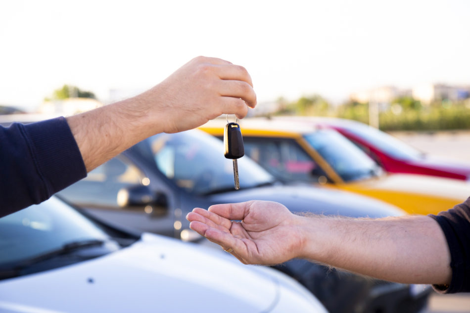 Handing over keys to newly sold car