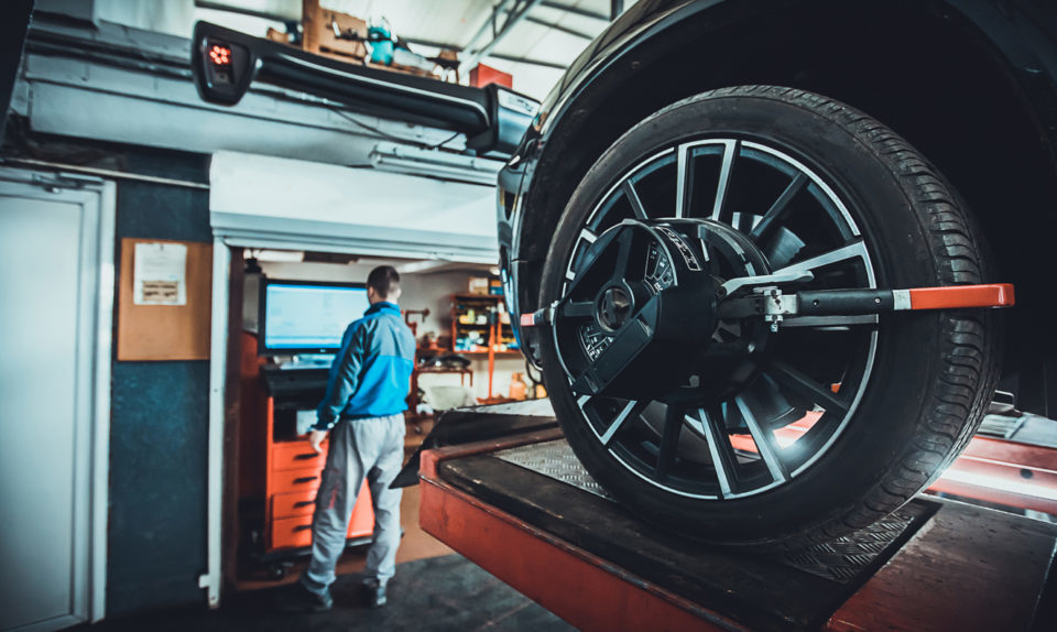 Wheel alignment equipment on a car wheel in a repair station