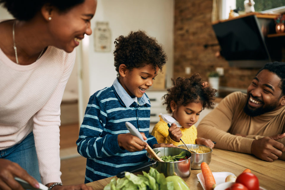 happy family preparing a meal together