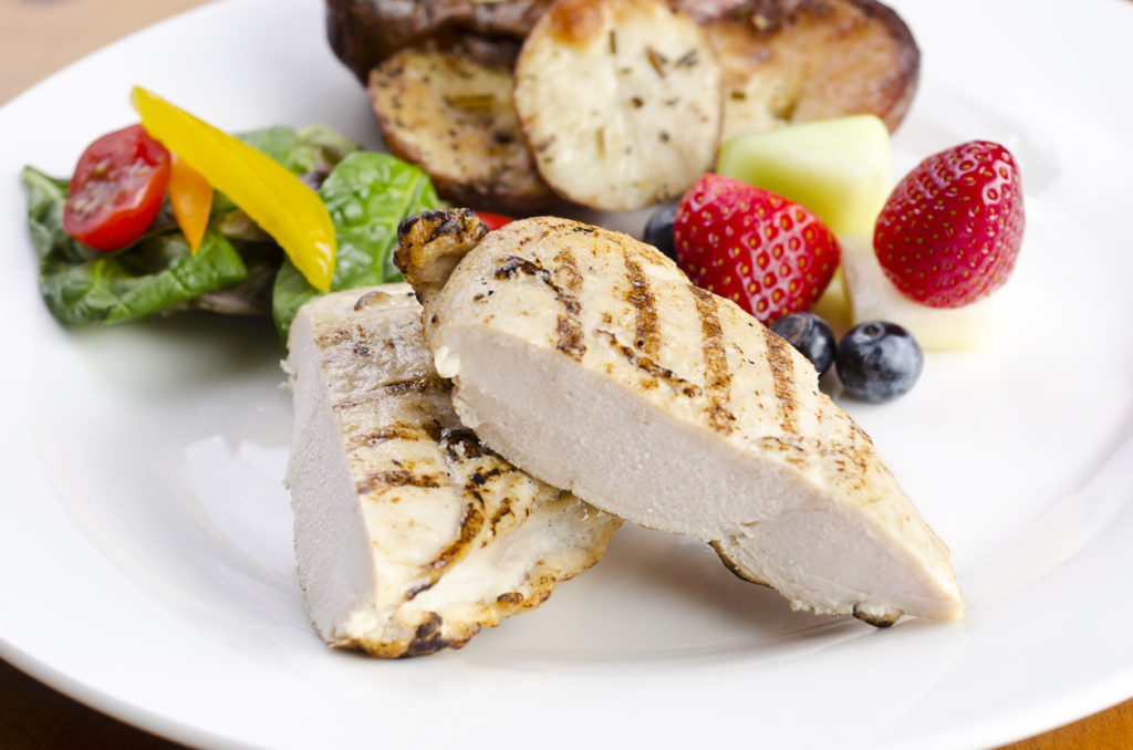 grilled chicken breasts with veggie sides