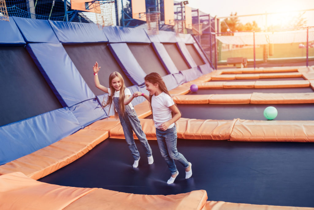 Children having fun jumping on trampoline